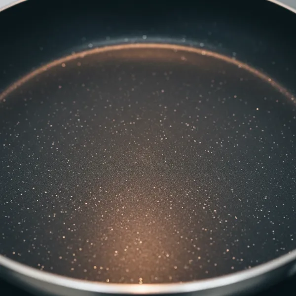 Close-up of a Swiss Diamond non-stick pan showcasing its diamond particle coating for durability and even cooking.
